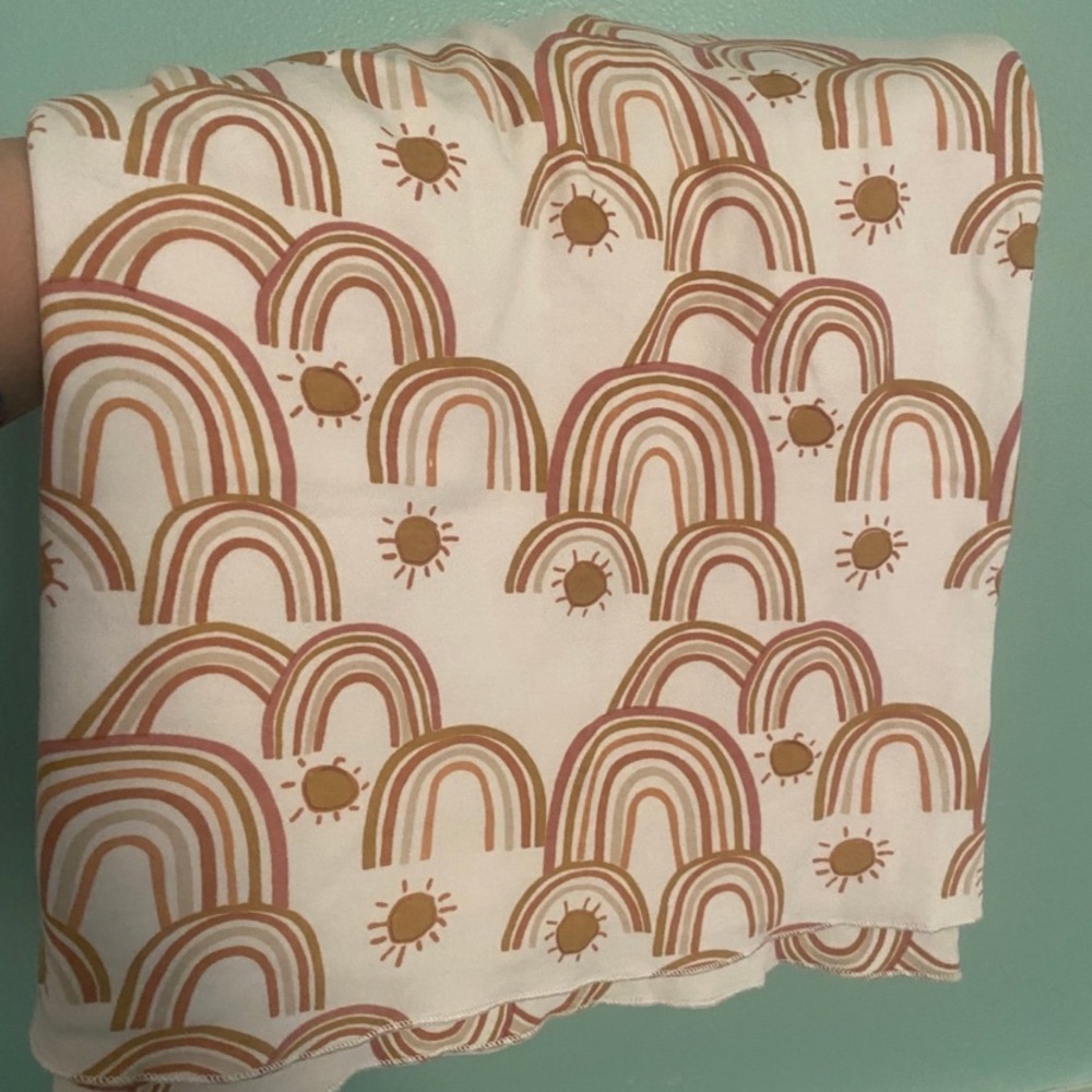 Kate Quinn rainbow swaddle
